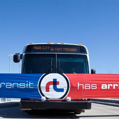 Ribbon saying Rapid Transit has arrived in front of bus