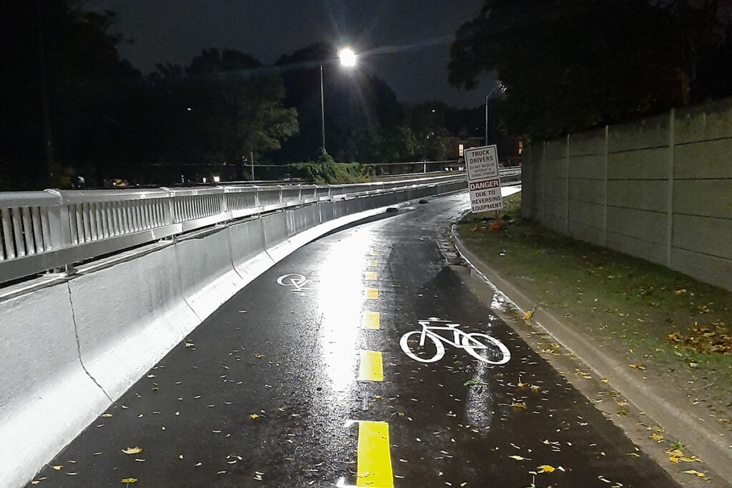 Trail at night with visible marked bike lanes