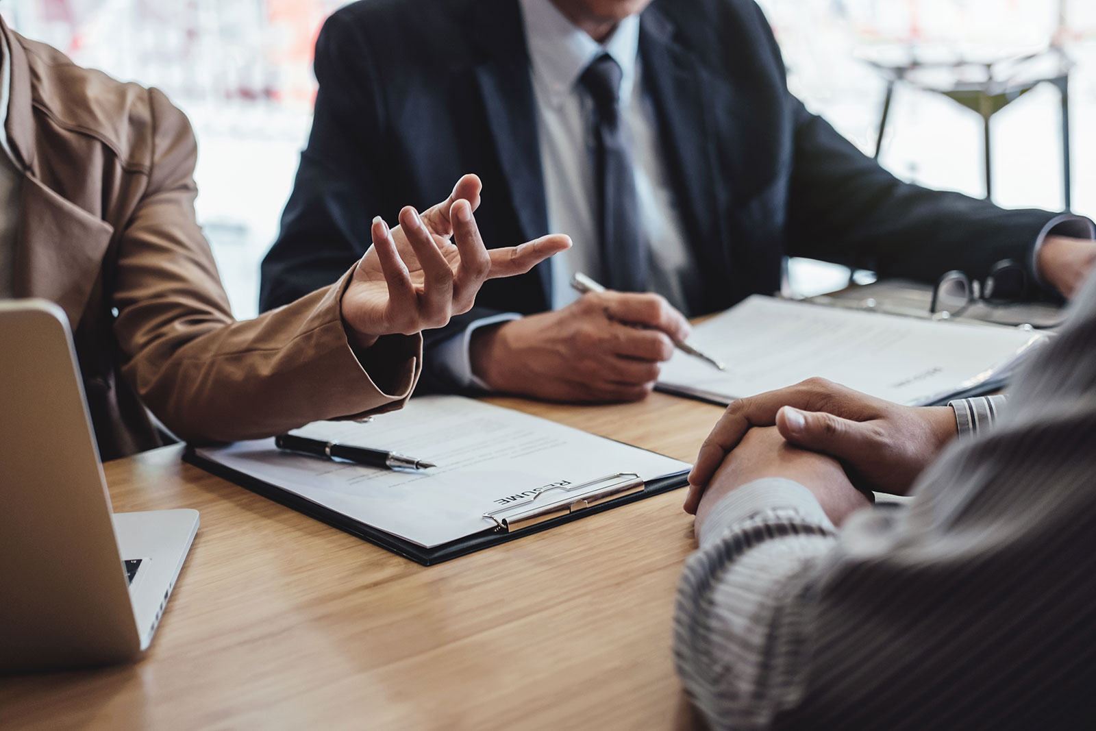 professionals sitting at a table in an office setting