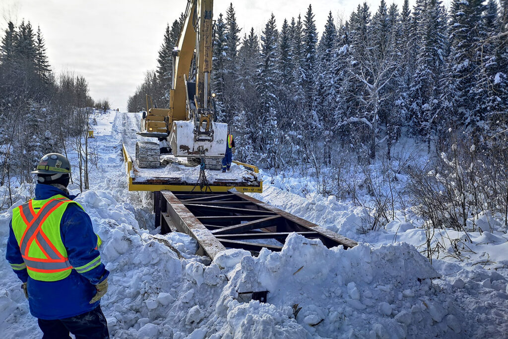 Excavator building access for the pipe