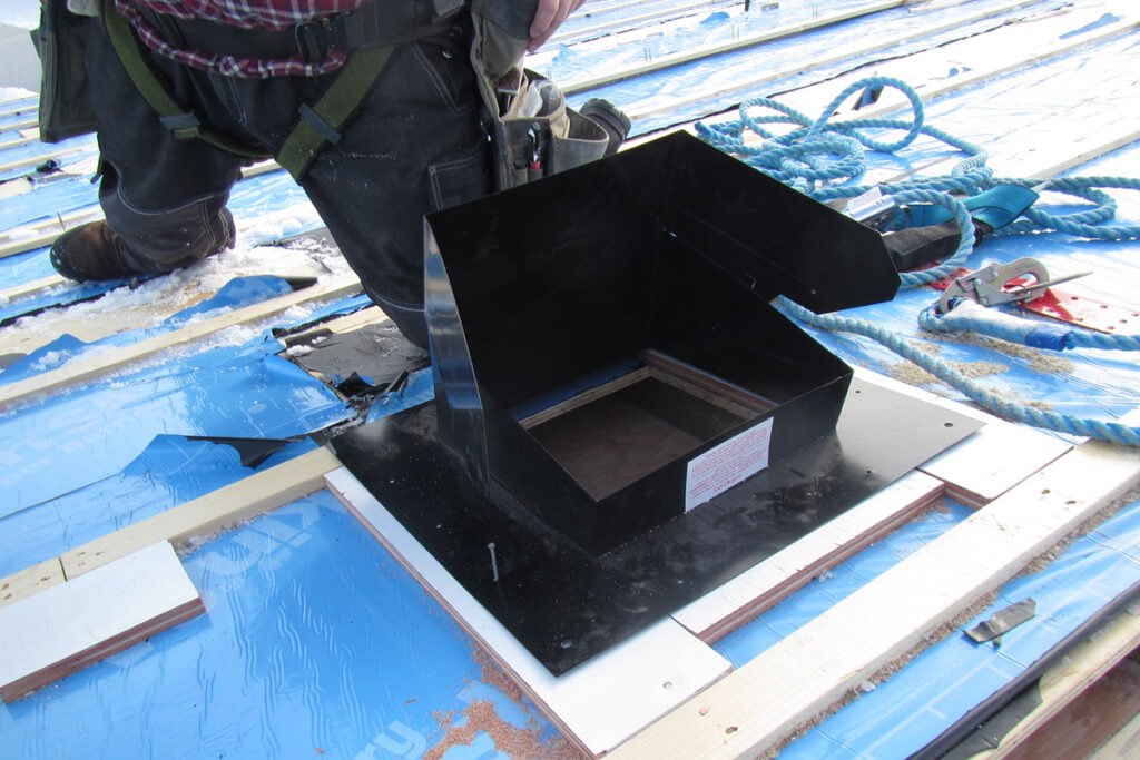 Installing a roof vent on a building