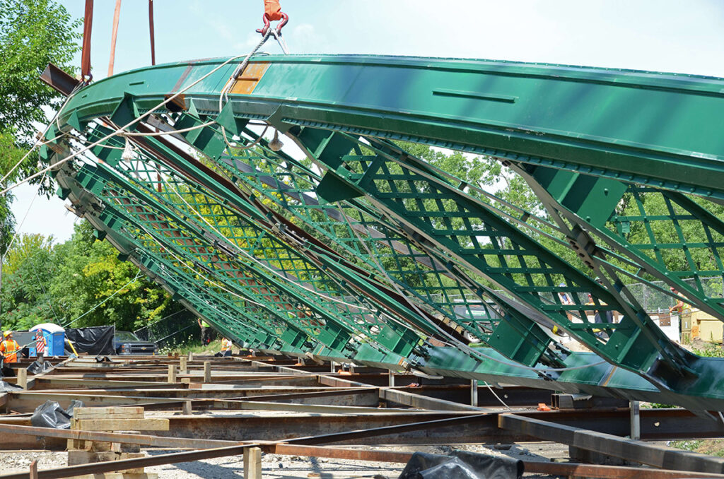 Raising side of the bridge into place