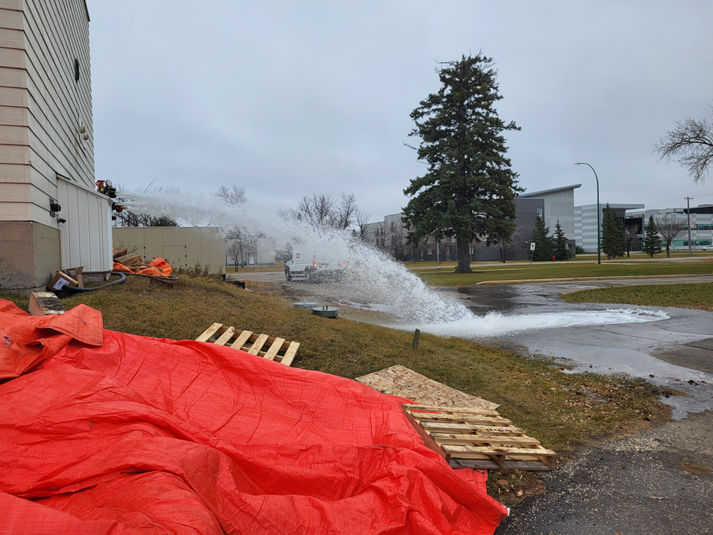 Water flowing out of a connection point for fire pump commissioning